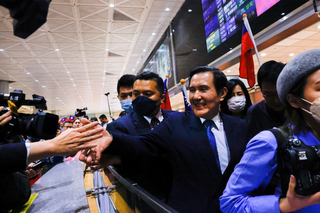 Former Taiwanese President Ma Ying-jeou greets people at the Taoyuan international airport after concluding his 12-day trip to China in Taoyuan, Taiwan on April 7, 2023.