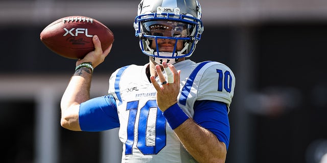 AJ McCarron warms up