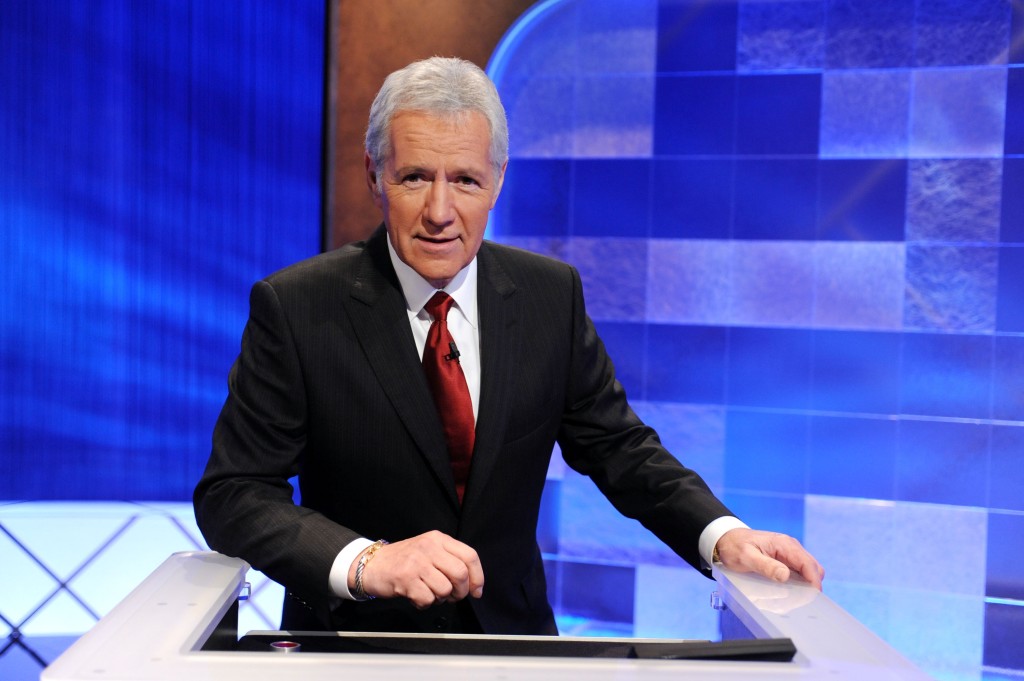 Game show host Alex Trebek poses on the set of the "Jeopardy!" Million Dollar Celebrity Invitational Tournament Show Taping. 