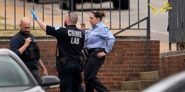 Law enforcement investigate the scene of a shooting at Central Visual and Performing Arts High School Monday, Oct. 24, 2022, in St. Louis.