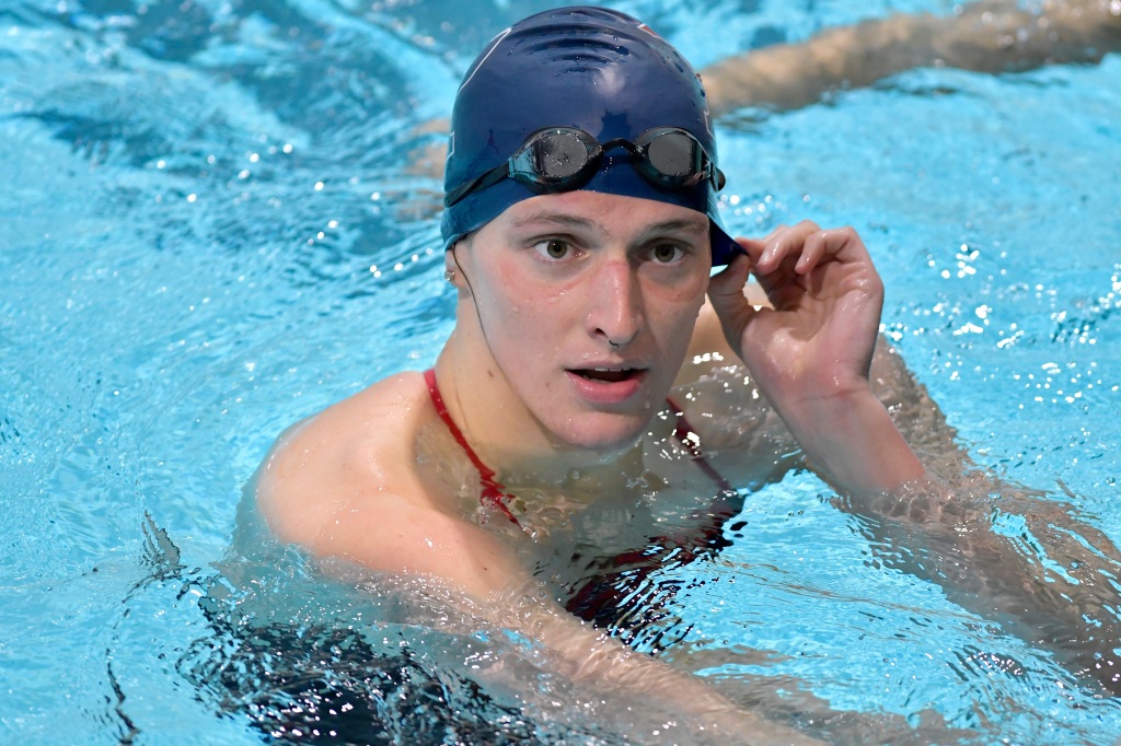 Transgender swimmer Lia Thomas speaks to her coach after winning the 500 meter freestyle during a meet with Harvard on Jan. 22, 2022