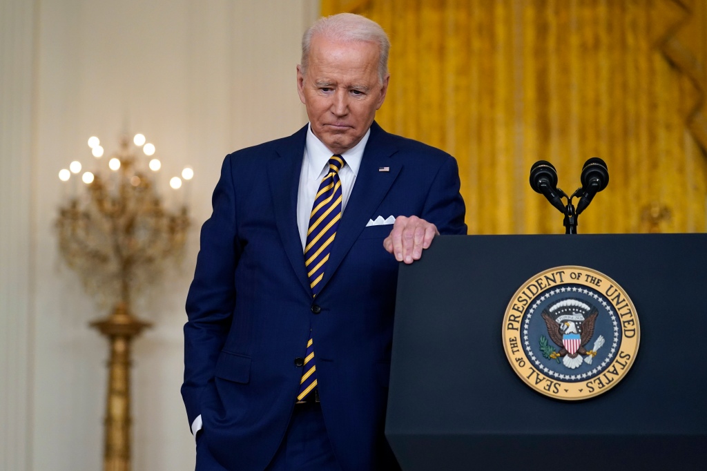 President Joe Biden listens to a question during a news conference in the East Room of the White House. 