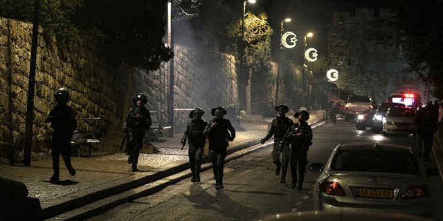 Israeli Border Police are deployed near the Lions' Gate to the Old City of Jerusalem during a raid by police of Al-Aqsa Mosque, Wednesday, April 5, 2023. 