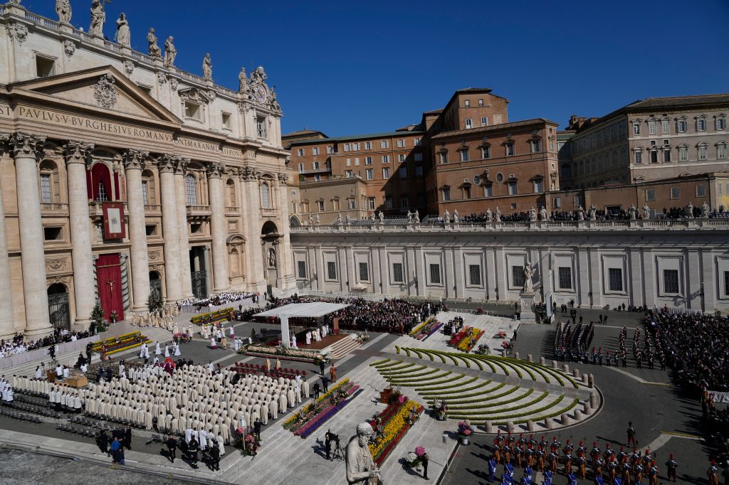An aerial shot shows Pope Francis sitting on the altar in St. Peter's Square at The Vatican ahead of Easter Sunday mass on April 9, 2023.