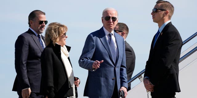 President Joe Biden gestures before he walked over to talk with reporters before boarding Air Force One, Tuesday, April 11, 2023, at Andrews Air Force Base, Md.