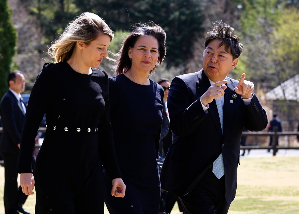 Canadian Foreign Minister Melanie Joly, left, German Foreign Minister Annalena Baerbock, center, and Japan's Foreign Minister Yoshimasa Hayashi walk to a group photo for G7 Foreign Ministers' meeting in Karuizawa, Japan, on April 17, 2023. 