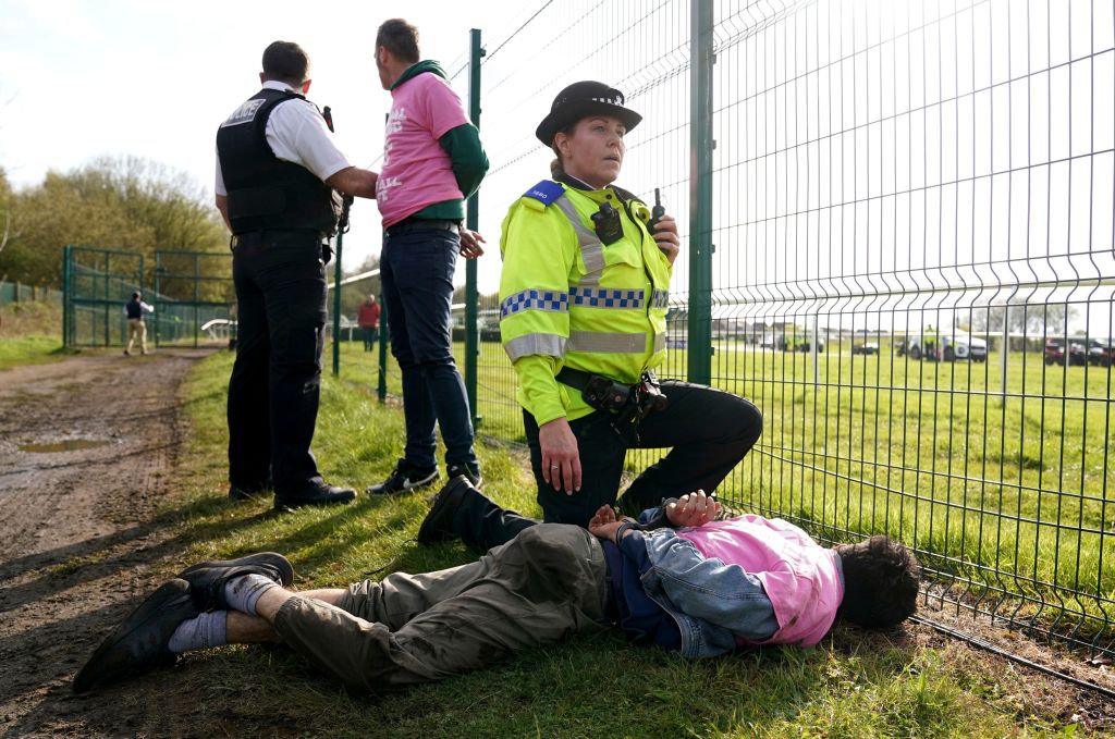 Many activists from an estimated group of 300 climbed the high fences around the racecourse just outside Liverpool and got onto the track a few minutes before the race was scheduled to start.