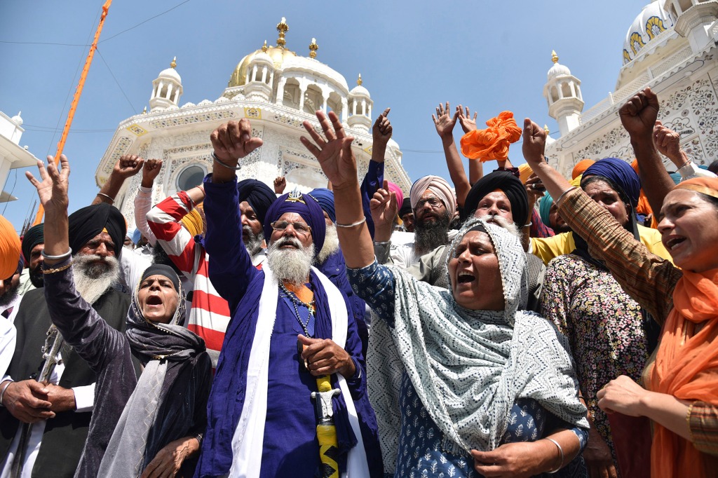 Supporters of Waris Punjab De organization shout slogans favoring their chief and separatist leader Amritpal Singh and other arrested activists during a meeting at the Akal Takht Secretariat inside Golden Temple complex, in Amritsar, India, on March 27, 2023.