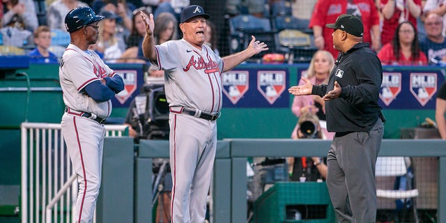 Atlanta Braves manager Brian Snitker has words with the umpire during the Royals game on April 14, 2023, at Kauffman Stadium in Kansas City, Missouri.