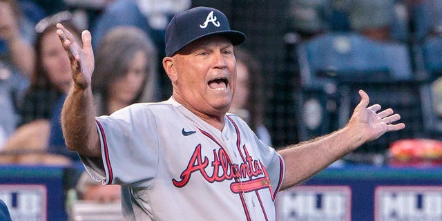 Atlanta defeated Kansas City 10-3 but manager Brian Snitker watched most of the game from the clubhouse after arguing a call.