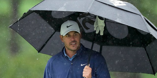 Brooks Koepka waits to play on the seventh hole during the weather-delayed third round of the Masters on Saturday, April 8, 2023.