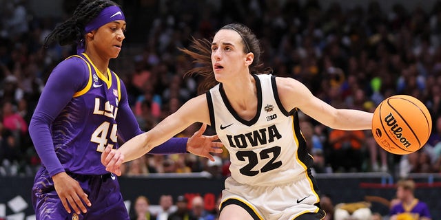 Alexis Morris of the LSU Lady Tigers defends against Caitlin Clark of the Iowa Hawkeyes during the NCAA Women's Basketball Tournament championship game at American Airlines Center on April 2, 2023, in Dallas.