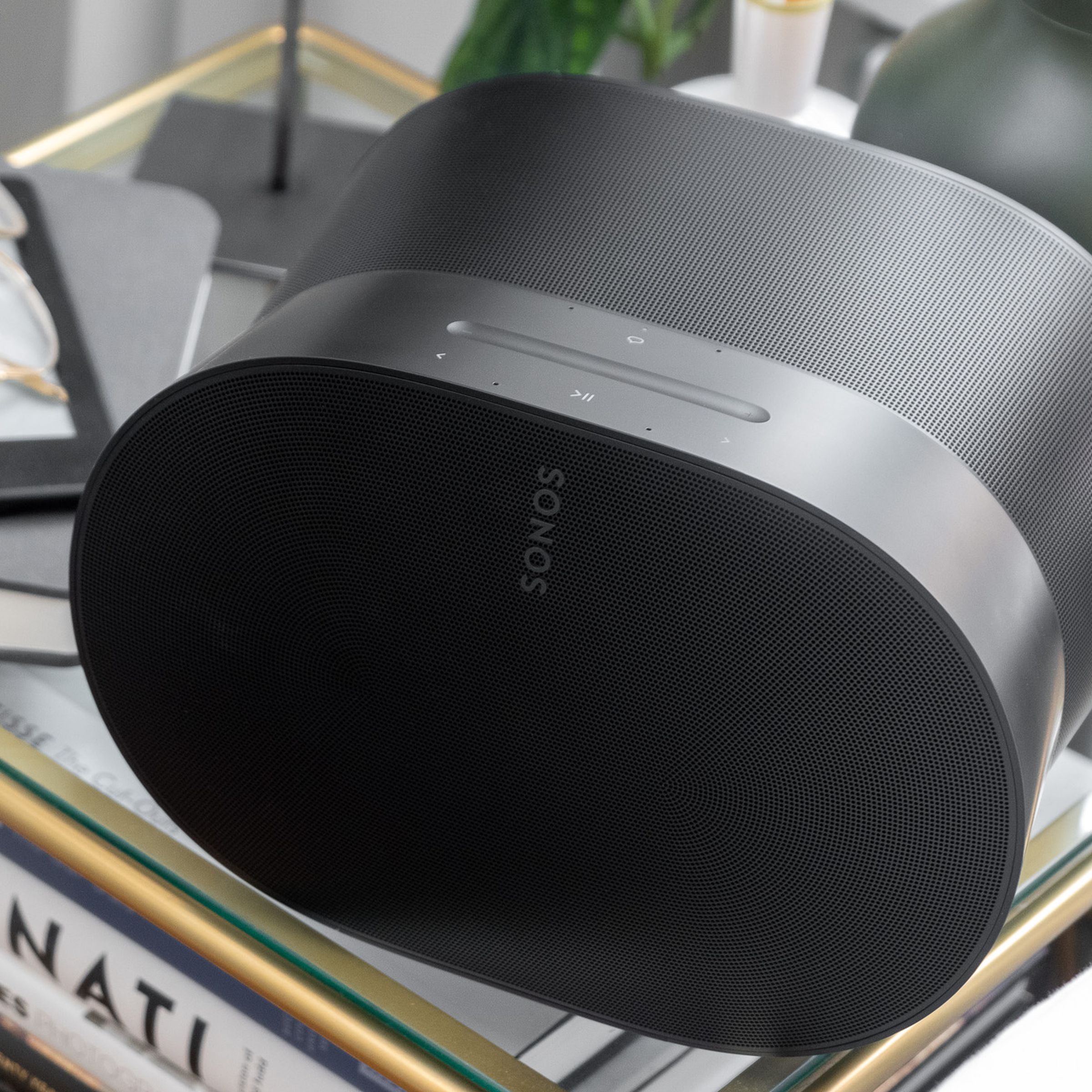 A photo of the Sonos Era 300 on a bedside table.