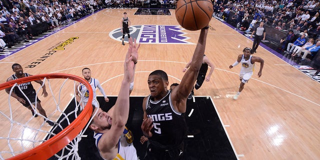 De'Aaron Fox of the Kings dunks the ball during the playoffs on April 15, 2023, at Golden 1 Center in Sacramento.