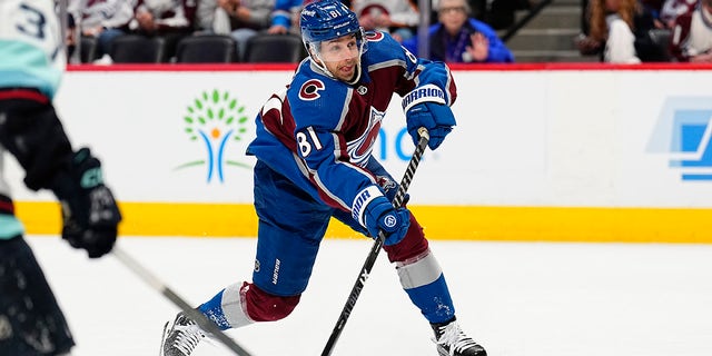 Colorado Avalanche center Denis Malgin shoots against the Seattle Kraken during the first period of Game 1 of a first-round NHL hockey playoff series Tuesday, April 18, 2023, in Denver. 