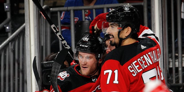 Dawson Mercer celebrates goal