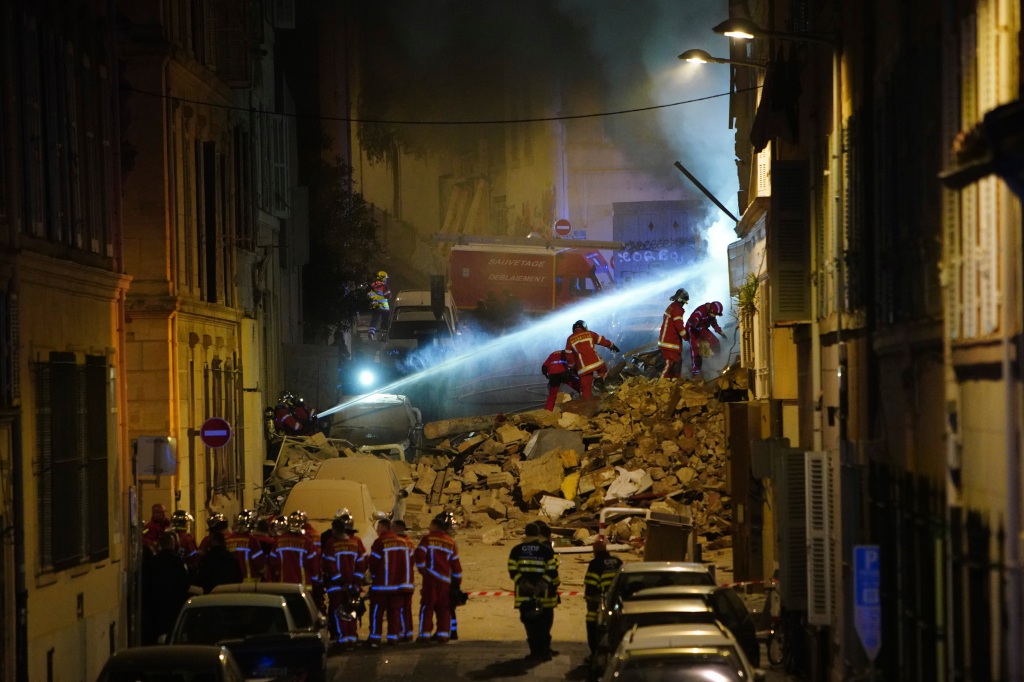 Firefighters work after building collapsed early on April 9, 2023 in Marseille, southern France.
