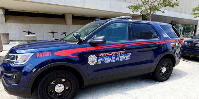 An Atlanta police vehicle sits parked outside State Farm Arena in Atlanta, Georgia on July 28, 2019.