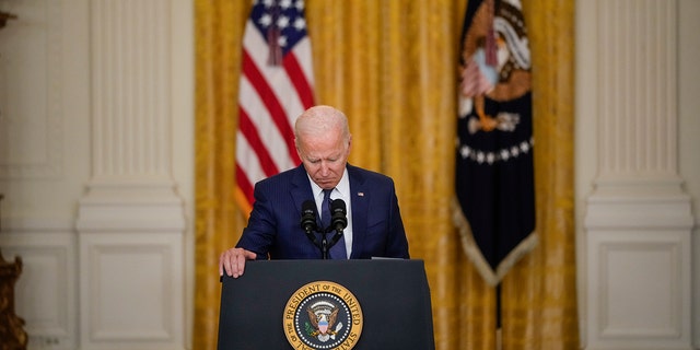 President Biden pauses while he speaks about the situation in Afghanistan in the East Room of the White House on August 26, 2021, in Washington, DC. At least 13 American service members were killed by suicide bomb attacks near the Hamid Karzai International Airport in Kabul, Afghanistan. 