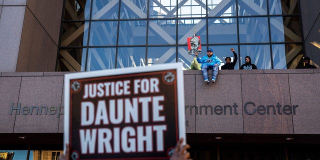 Daunte Wright's brothers await the verdict in Kim Potter's trial at the Hennepin County Courthouse in Minneapolis on Dec. 23, 2021. The county had a major leadership overhaul in the wake of George Floyd's death.