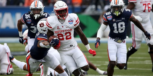 Alton McCaskill carries the football