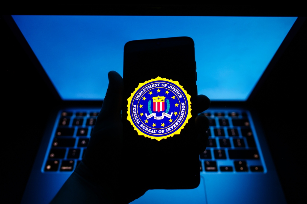 The FBI seal is displayed on a podium before a news conference at the agency's headquarters in Washington.  
