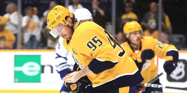 Nashville Predators center Matt Duchene (95) skates to the bench after sustaining a hand injury during the NHL game between the Nashville Predators and Toronto Maple Leafs, held on March 26, 2023, at Bridgestone Arena in Nashville, Tennessee.  