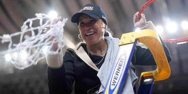 Head coach Dawn Staley of the South Carolina Gamecocks celebrates after defeating Maryland Terrapins during the Elite Eight round of the 2023 NCAA Womens Basketball Tournament held at Bon Secours Wellness Arena on March 27, 2023, in Greenville, South Carolina. 