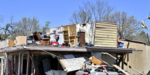 Building collapses killed several people across the country as severe storm systems and tornadoes swept through the Midwest.