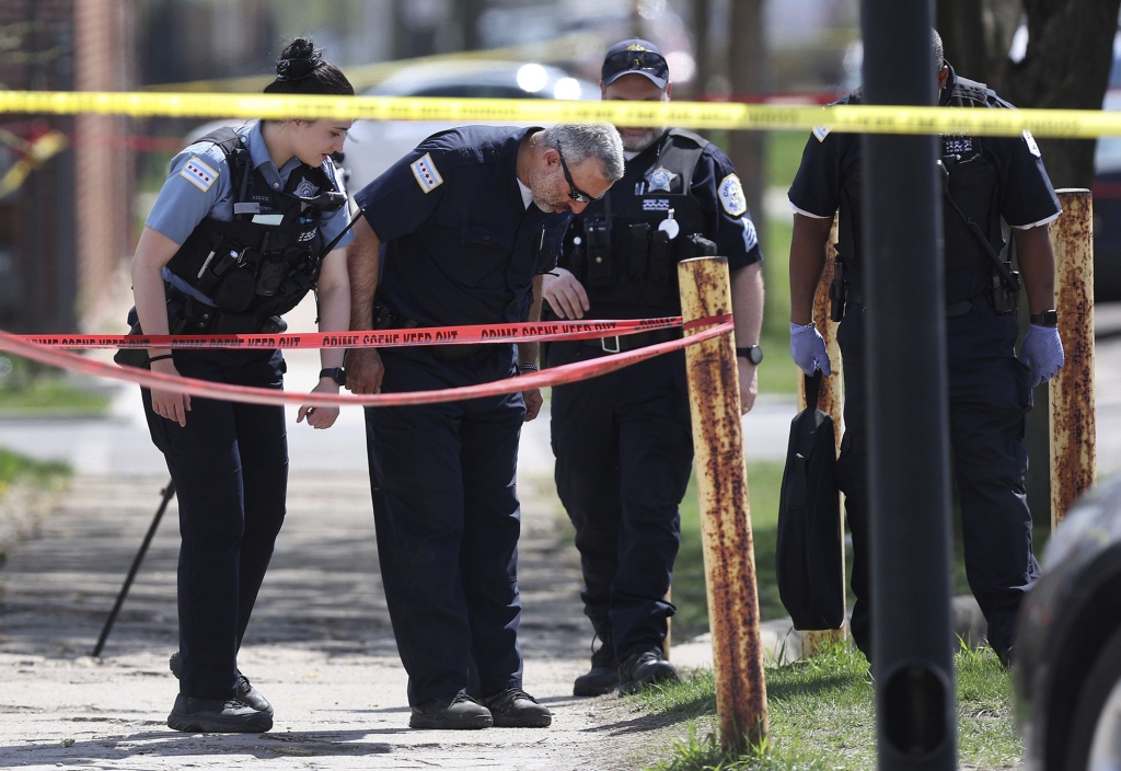 Chicago police work the scene following a police involved shooting on April 15, 2023, in Chicago. 