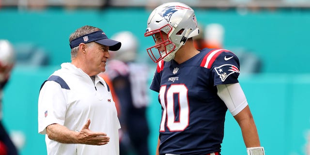 Head coach Bill Belichick and Mac Jones during pregame at Hard Rock Stadium Sept. 11, 2022, in Miami Gardens, Fla. 