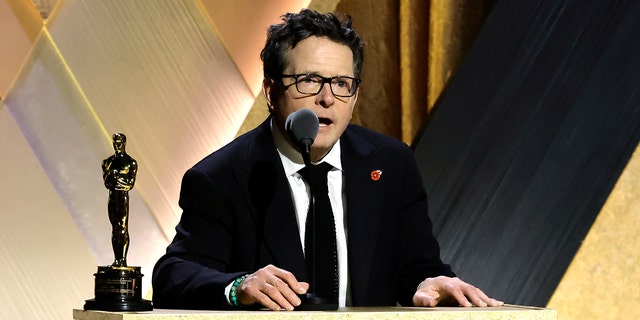 Michael J. Fox gives a speech at the podium at the Governors Award