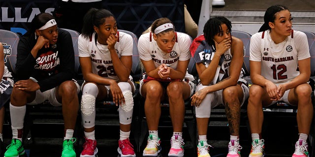 The South Carolina Gamecocks bench reacts in the closing seconds of the fourth quarter against the Iowa Hawkeyes during the 2023 NCAA Tournament Final Four at American Airlines Center March 31, 2023, in Dallas, Texas. 