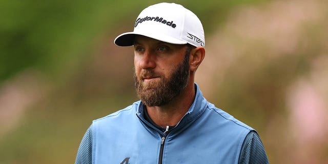 Dustin Johnson of the United States looks on from the 13th green during a practice round prior to the 2023 Masters Tournament at Augusta National Golf Club April 3, 2023, in Augusta, Ga.