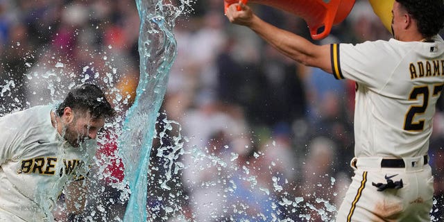 Garrett Mitchell of the Milwaukee Brewers is doused as he celebrates his walk-off home run against the New York Mets at American Family Field on April 5, 2023. 