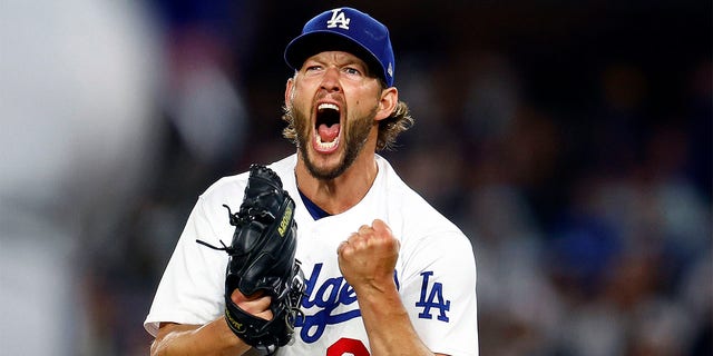 Clayton Kershaw reacts after striking out a batter