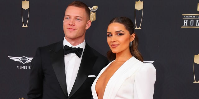 Carolina Panthers running back Christian McCaffrey and Olivia Culpo pose on the red carpet prior to the NFL Honors Feb. 1, 2020, at the Adrienne Arsht Center in Miami, Fla.   