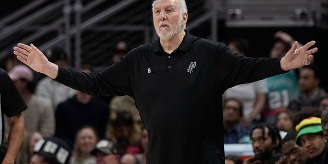 San Antonio Spurs head coach Gregg Popovich signals to his players during the first half of an NBA basketball game against the Portland Trail Blazers in Austin, Texas, Thursday, April 6, 2023.