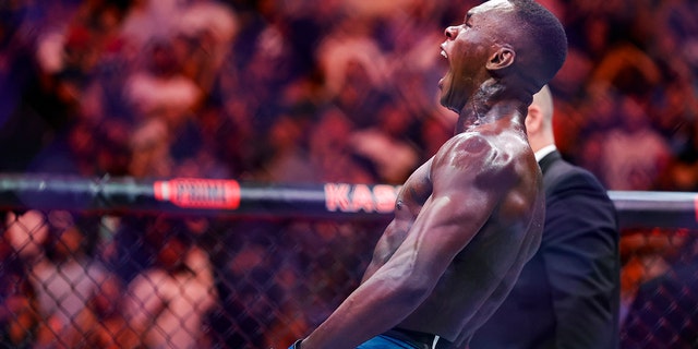 Israel Adesanya celebrates after knocking out Alex Pereira at Kaseya Center on April 8, 2023, in Miami.