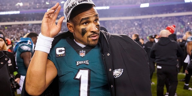 Philadelphia Eagles quarterback Jalen Hurts walks on the field after the NFC Championship NFL football game between the Philadelphia Eagles and the San Francisco 49ers on Sunday, Jan. 29, 2023, in Philadelphia.