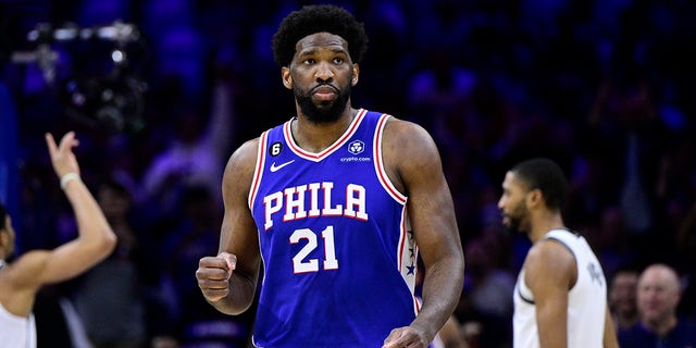 Philadelphia 76ers' Joel Embiid reacts after a score by Tobias Harris in the first half during Game 2 in the first round of the NBA basketball playoffs against the Brooklyn Nets, Monday, April 17, 2023, in Philadelphia. 