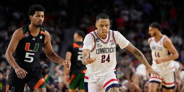 Connecticut guard Jordan Hawkins (24) celebrates after scoring against Miami during the second half of a Final Four college basketball game in the NCAA Tournament on Saturday, April 1, 2023, in Houston. 