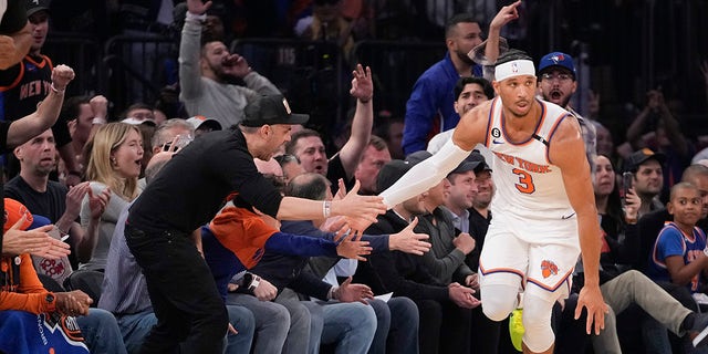 Josh Hart shakes hands of fans