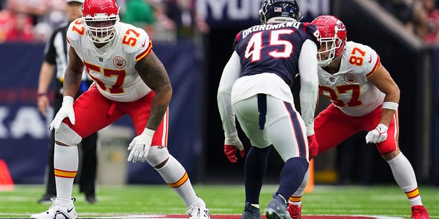 Orlando Brown Jr. (57) of the Kansas City Chiefs and Travis Kelce (87) get set against the Houston Texans at NRG Stadium Dec. 18, 2022, in Houston. 
