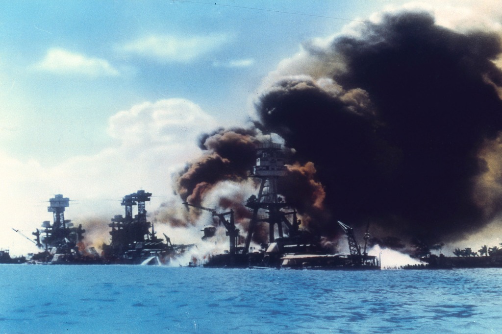 The USS Arizona engulfed in flame after being struck by a Japanese torpedo during the attack on Pearl Harbor, Honolulu, Oahu, Hawaii, Dec. 7, 1941.