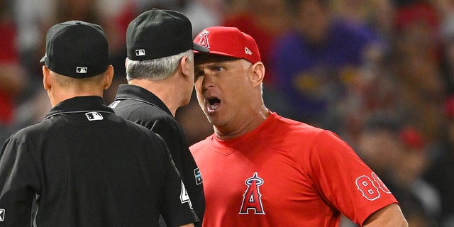 Phil Nevin argues with an umpire during a game