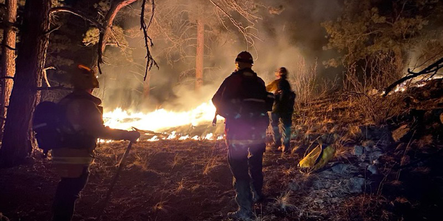 Firefighters have worked tirelessly to contain the fire, despite wind gusts up to 50 mph.