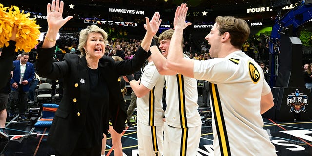 Lisa Bluder, head coach of the Iowa Hawkeyes, celebrates their win over the South Carolina Gamecocks in the NCAA Tournament's Final Four at American Airlines Center March 31, 2023, in Dallas, Texas.