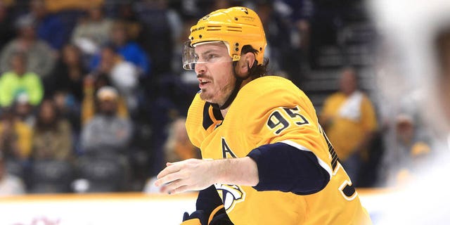 Nashville Predators center Matt Duchene (95) skates to the bench after sustaining a hand injury during the NHL game between the Nashville Predators and Toronto Maple Leafs, held on March 26, 2023, at Bridgestone Arena in Nashville, Tennessee. 