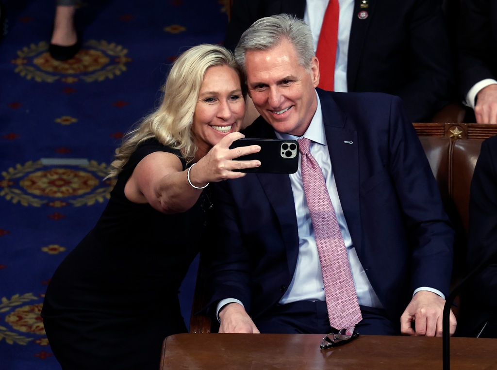 Rep. Marjorie Taylor Greene (R-GA) is pictured taking a photo with U.S. House Republican Leader Kevin McCarthy after he was elected Speaker.